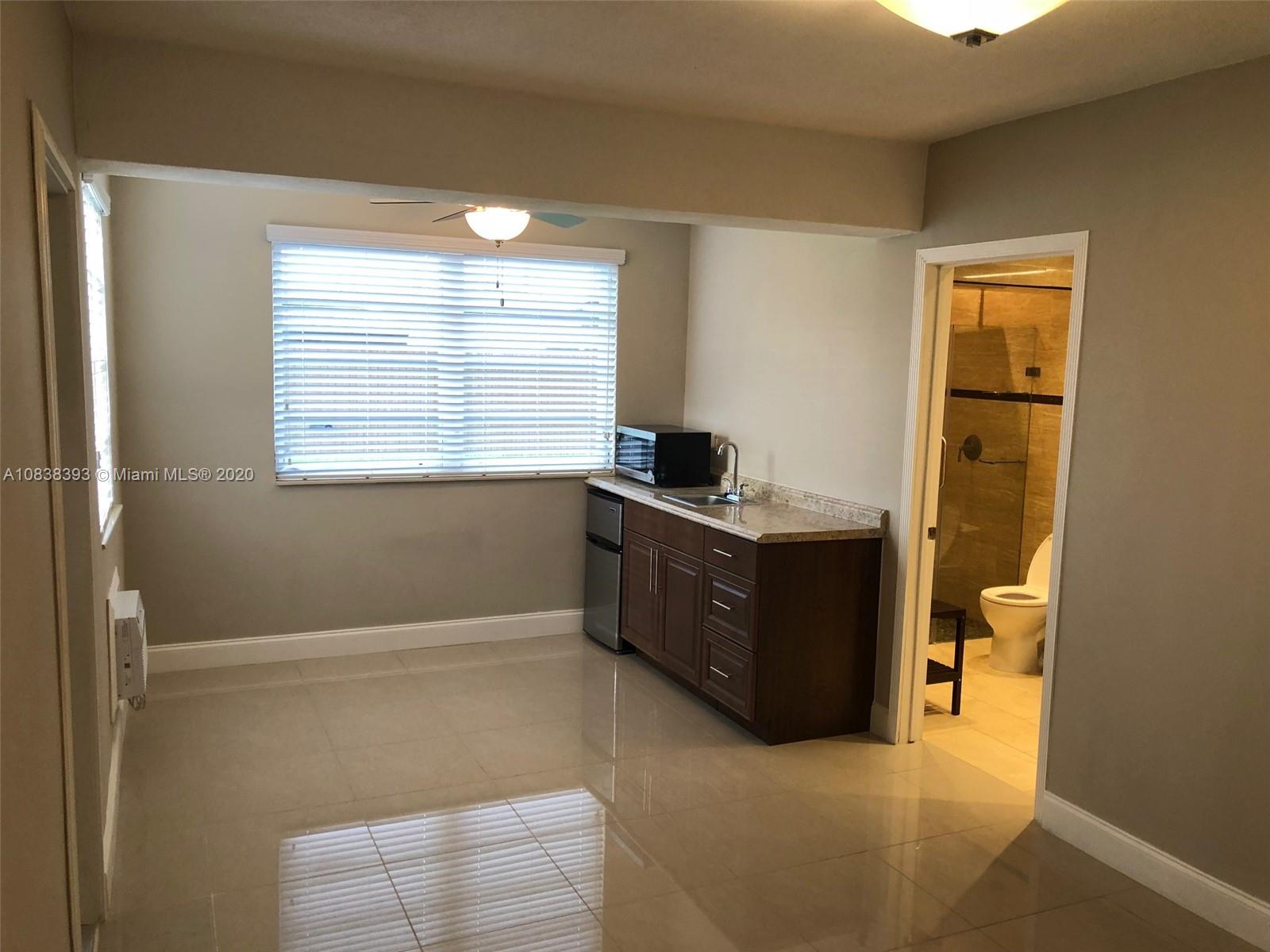 1220 West 62nd Street Hialeah, FL 33012 - Photo 11 of 53 a room with a window