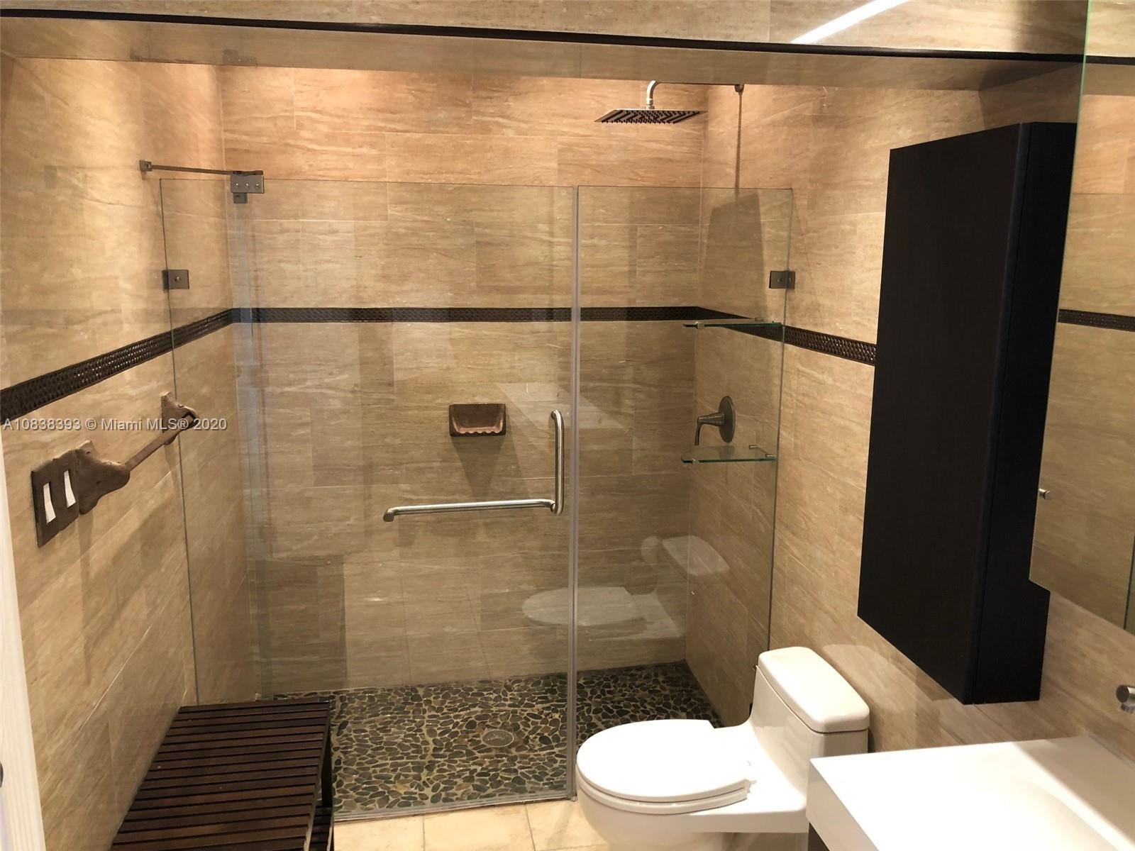 1220 West 62nd Street Hialeah, FL 33012 - Photo 13 of 53 a bathroom with a toilet and a shower