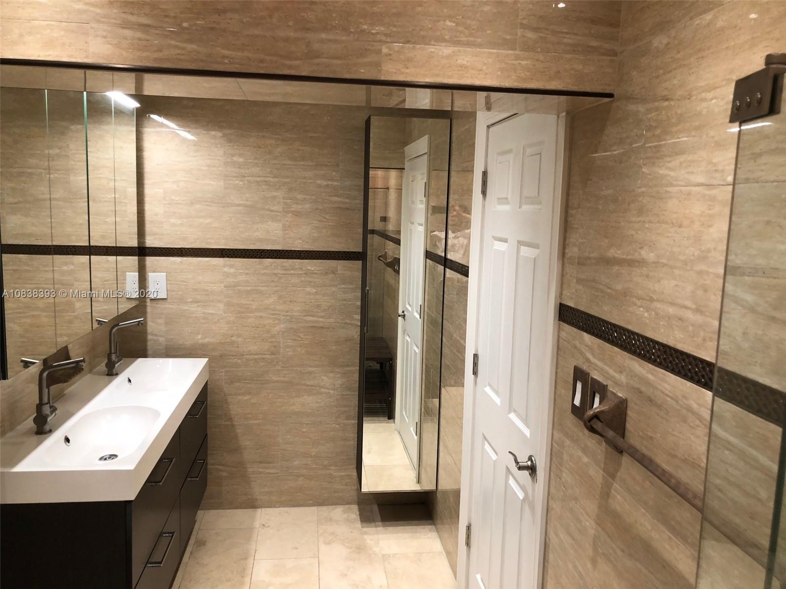 1220 West 62nd Street Hialeah, FL 33012 - Photo 15 of 53 a bathroom with a sink and a mirror