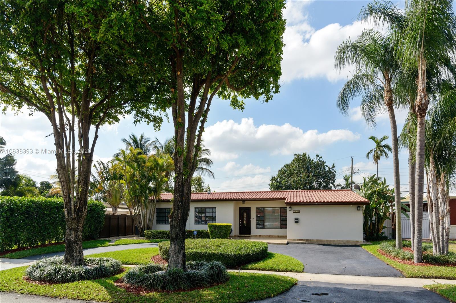 1220 West 62nd Street Hialeah, FL 33012 - Photo 20 of 53 a front view of a house with garden