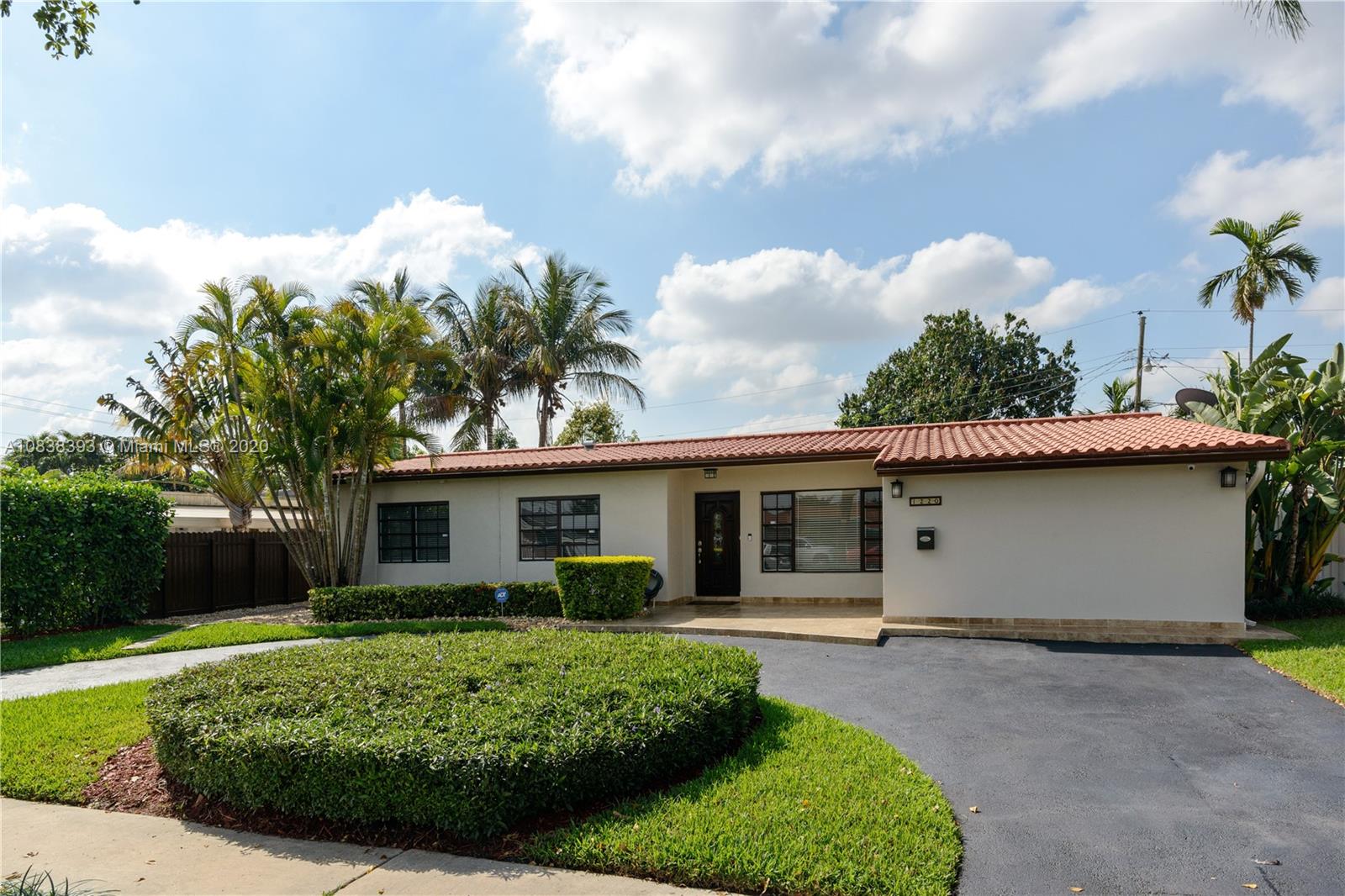 1220 West 62nd Street Hialeah, FL 33012 - Photo 21 of 53 a view of a house with backyard and garden