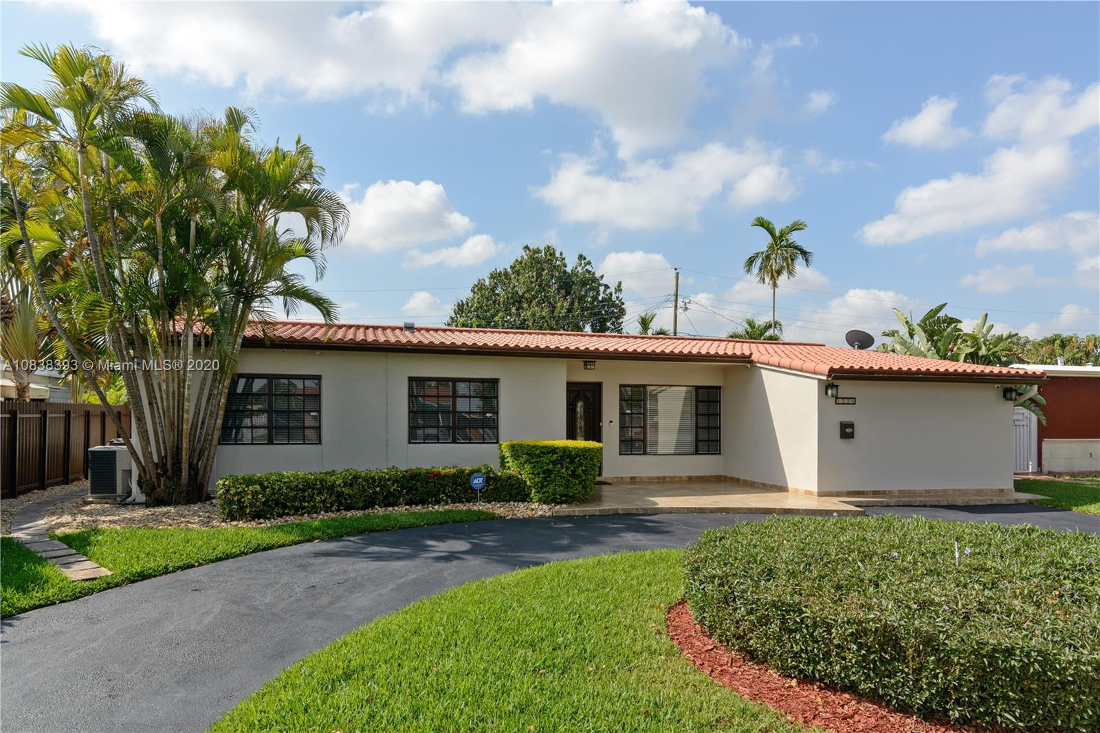 1220 West 62nd Street Hialeah, FL 33012 - Photo 22 of 53 a front view of house with yard and green space