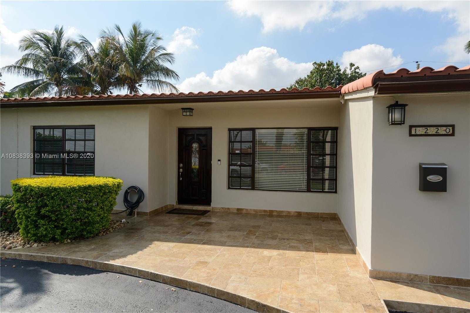 1220 West 62nd Street Hialeah, FL 33012 - Photo 23 of 53 a front view of a house with a garage