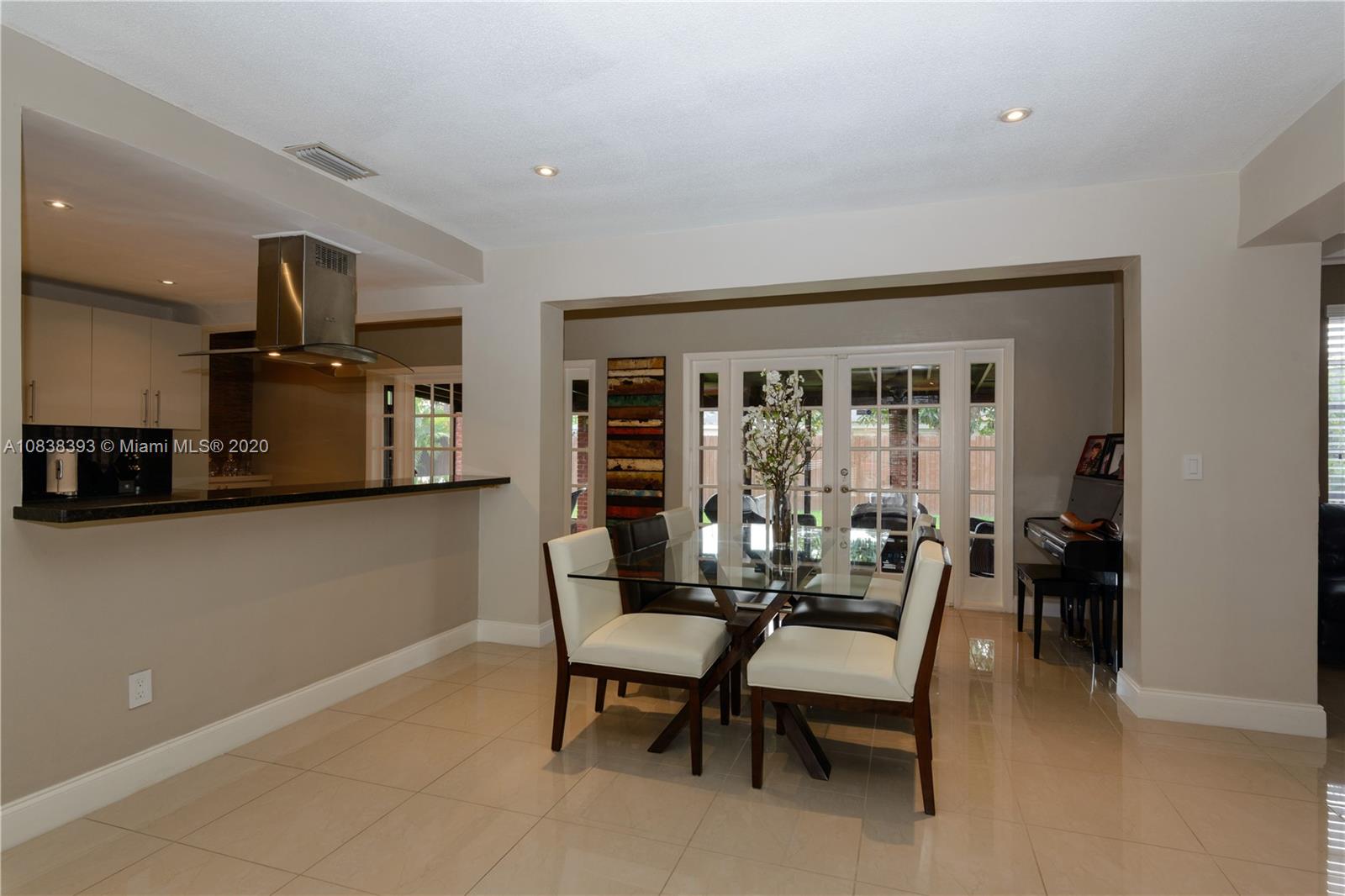 1220 West 62nd Street Hialeah, FL 33012 - Photo 28 of 53 a dining room with furniture and large windows
