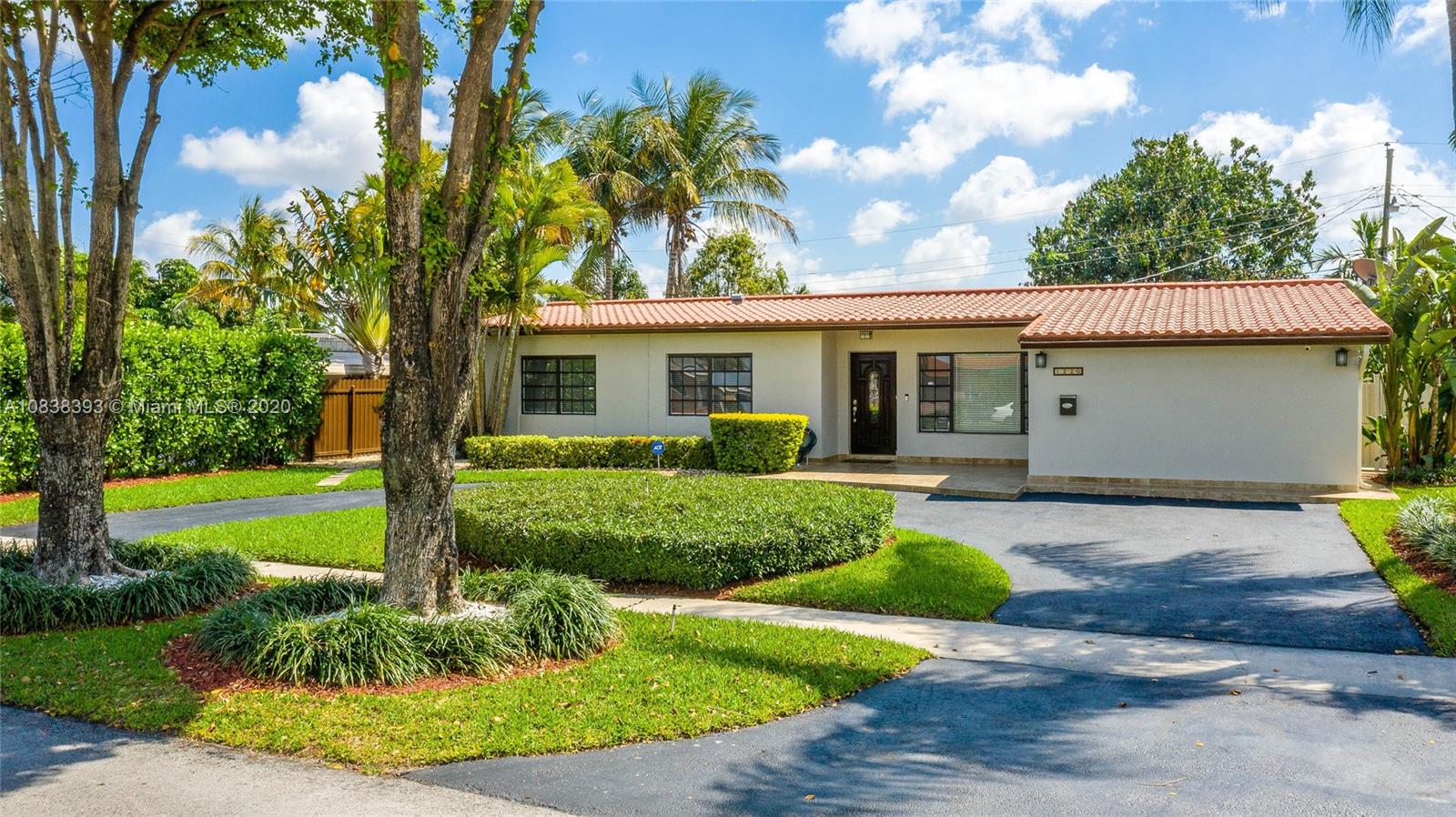 1220 West 62nd Street Hialeah, FL 33012 - Photo 3 of 53 front view of a house with a yard