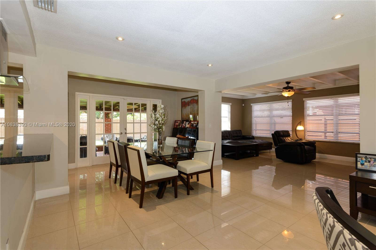 1220 West 62nd Street Hialeah, FL 33012 - Photo 33 of 53 a living room with furniture and a flat screen tv