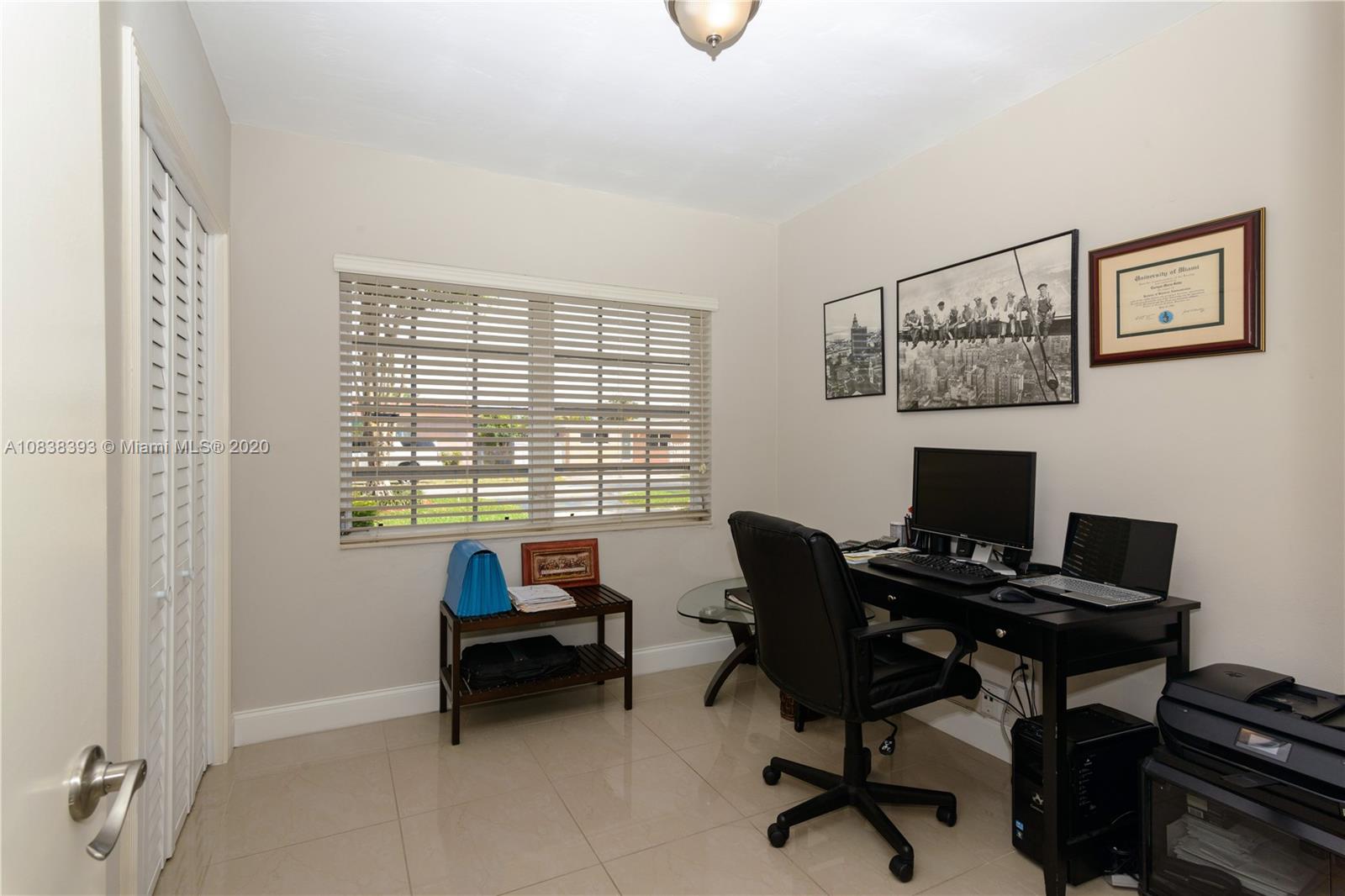1220 West 62nd Street Hialeah, FL 33012 - Photo 34 of 53 a work room with furniture and a window