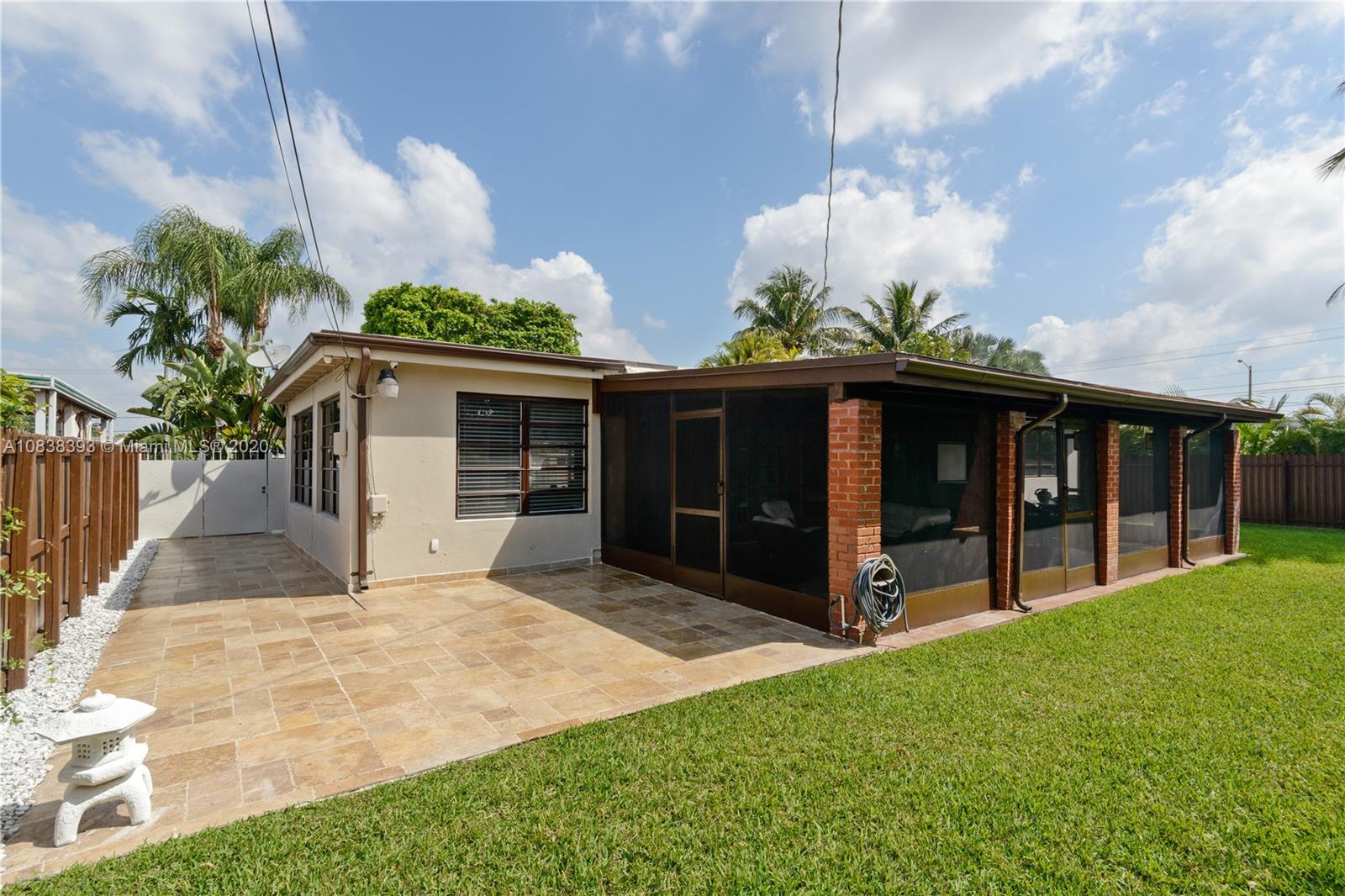 1220 West 62nd Street Hialeah, FL 33012 - Photo 39 of 53 a view of a house with a yard and potted plants