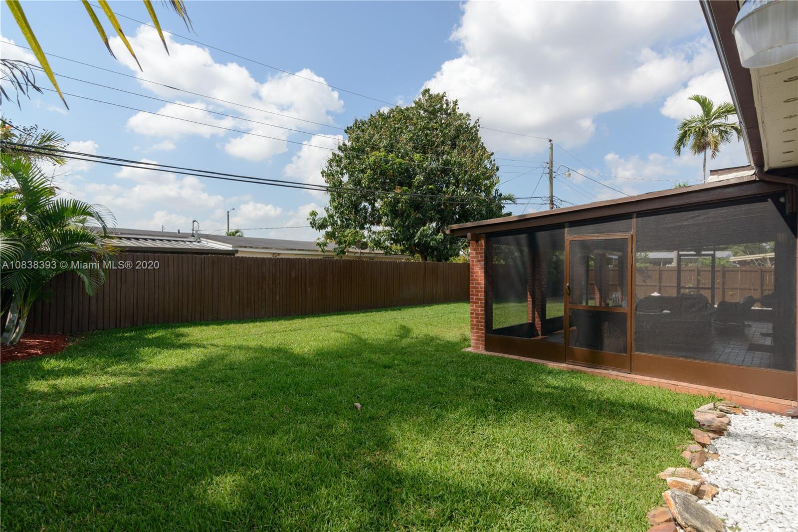 1220 West 62nd Street Hialeah, FL 33012 - Photo 45 of 53 a view of backyard with swimming pool and porch