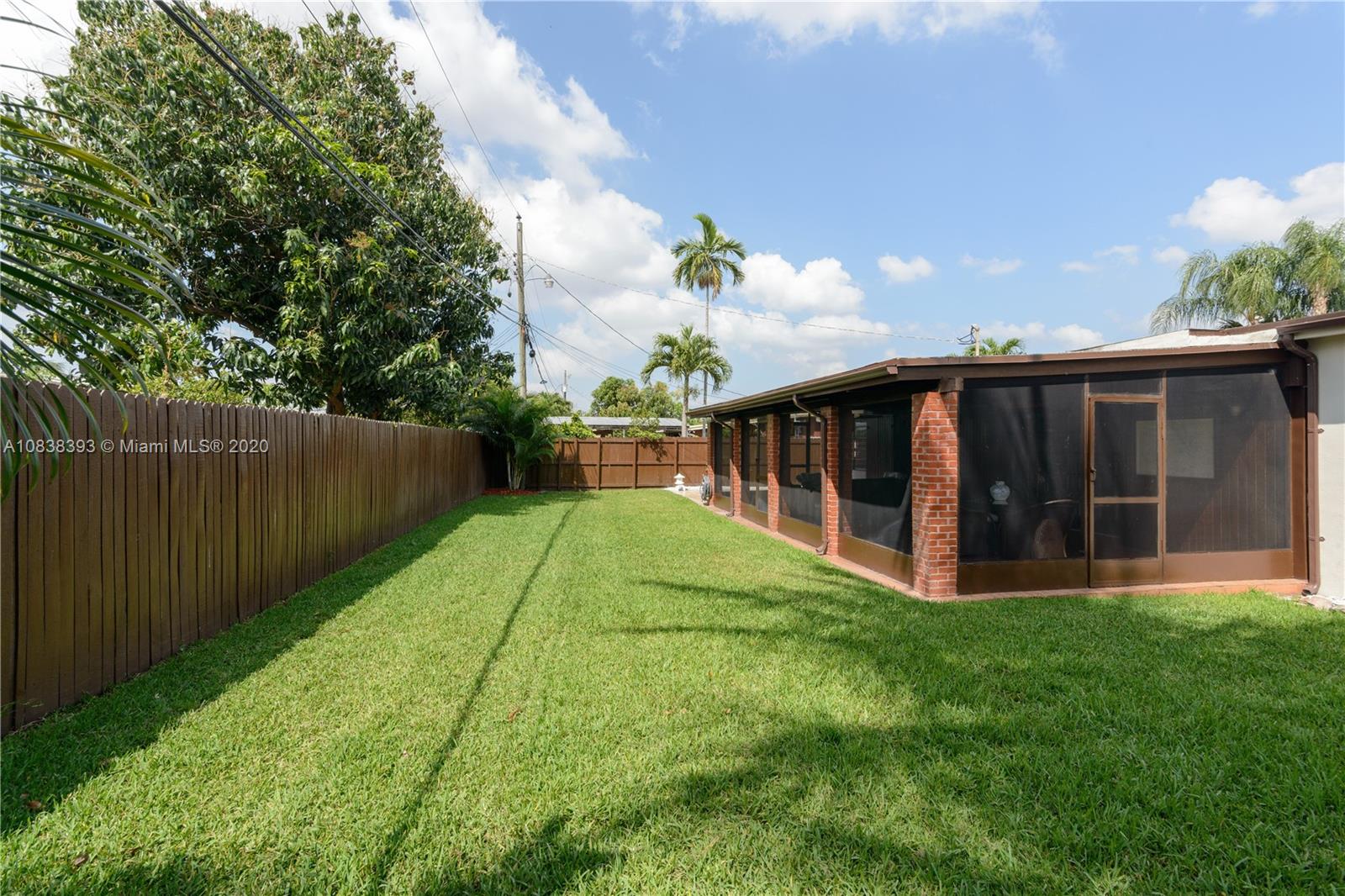 1220 West 62nd Street Hialeah, FL 33012 - Photo 46 of 53 a view of a house with backyard and garden