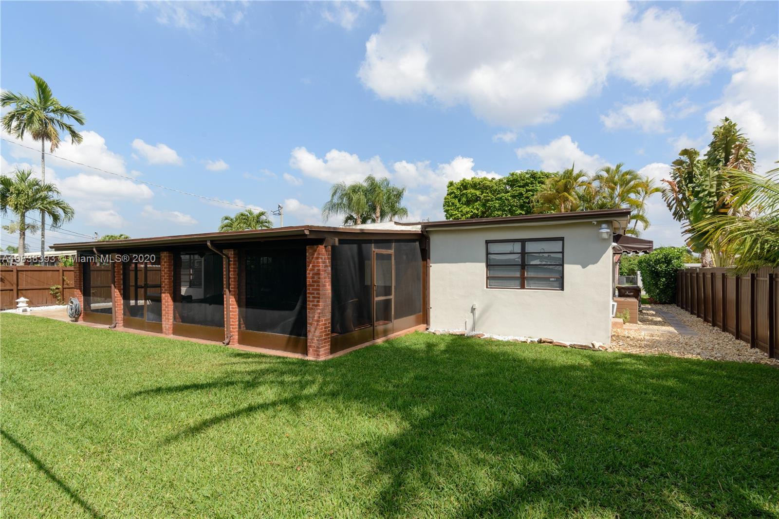 1220 West 62nd Street Hialeah, FL 33012 - Photo 47 of 53 a view of a house with a yard and sitting area