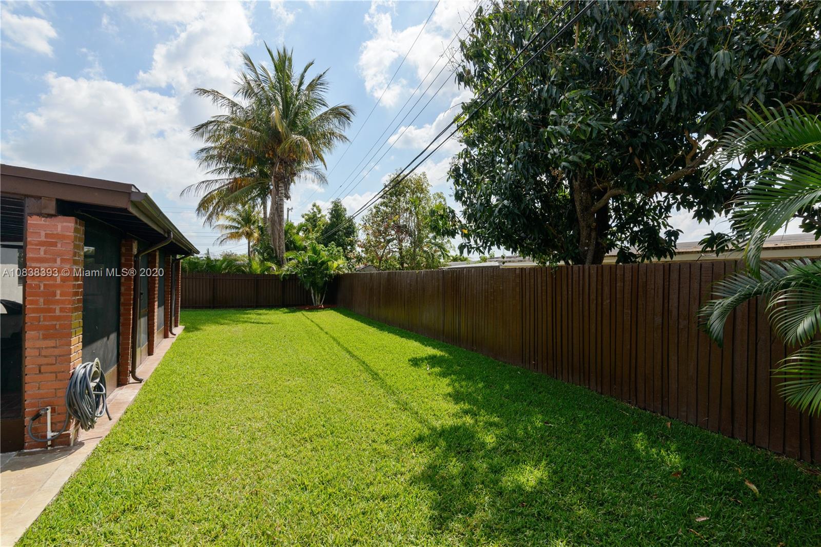 1220 West 62nd Street Hialeah, FL 33012 - Photo 48 of 53 a view of a backyard with a garden