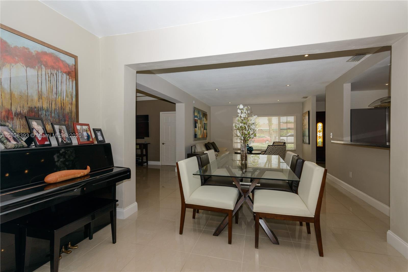 1220 West 62nd Street Hialeah, FL 33012 - Photo 49 of 53 a dining room with furniture and wooden floor