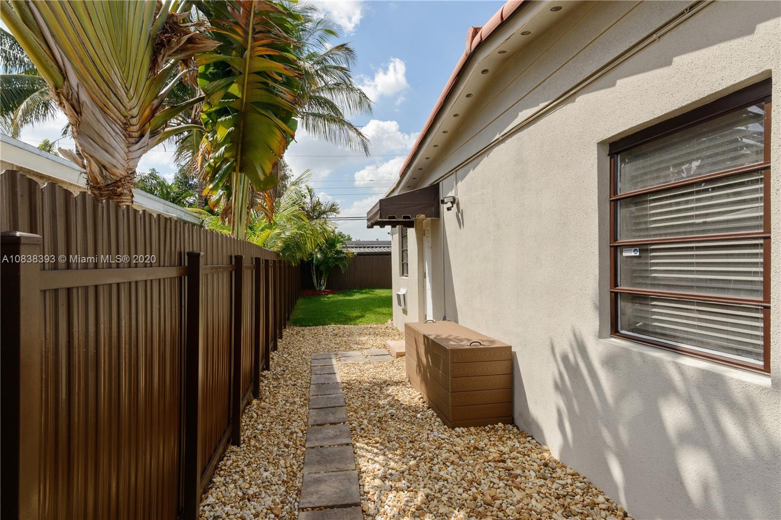 1220 West 62nd Street Hialeah, FL 33012 - Photo 52 of 53 a view of a back yard from a corridor