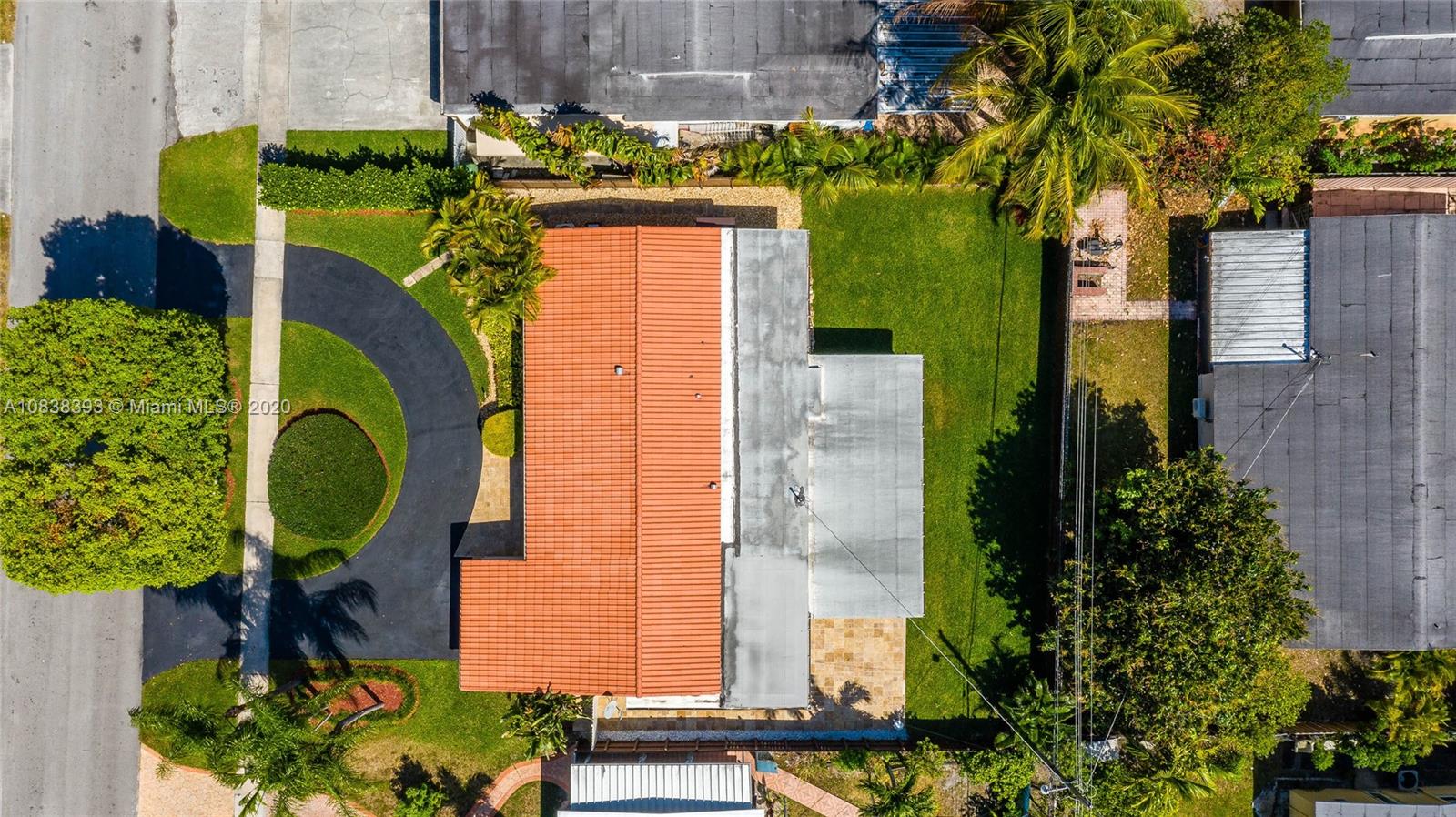 1220 West 62nd Street Hialeah, FL 33012 - Photo 6 of 53 an aerial view of a house with a swimming pool