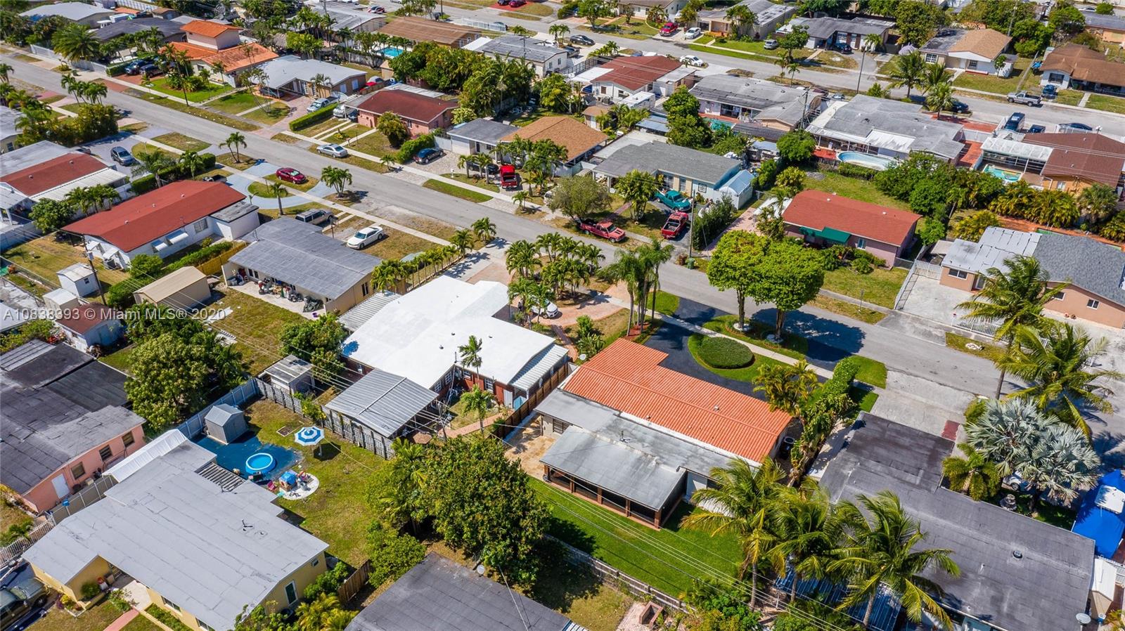 1220 West 62nd Street Hialeah, FL 33012 - Photo 7 of 53 an aerial view of residential houses with outdoor space