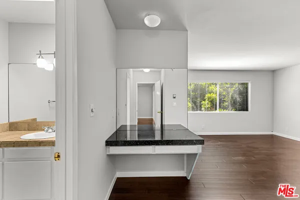 a view of kitchen with a sink and a window