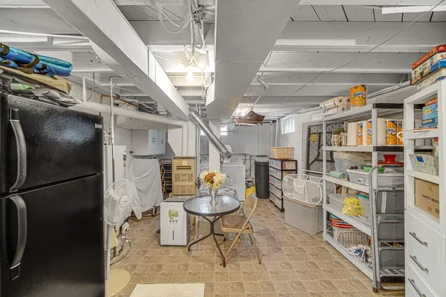 a view of a garage with wooden furniture