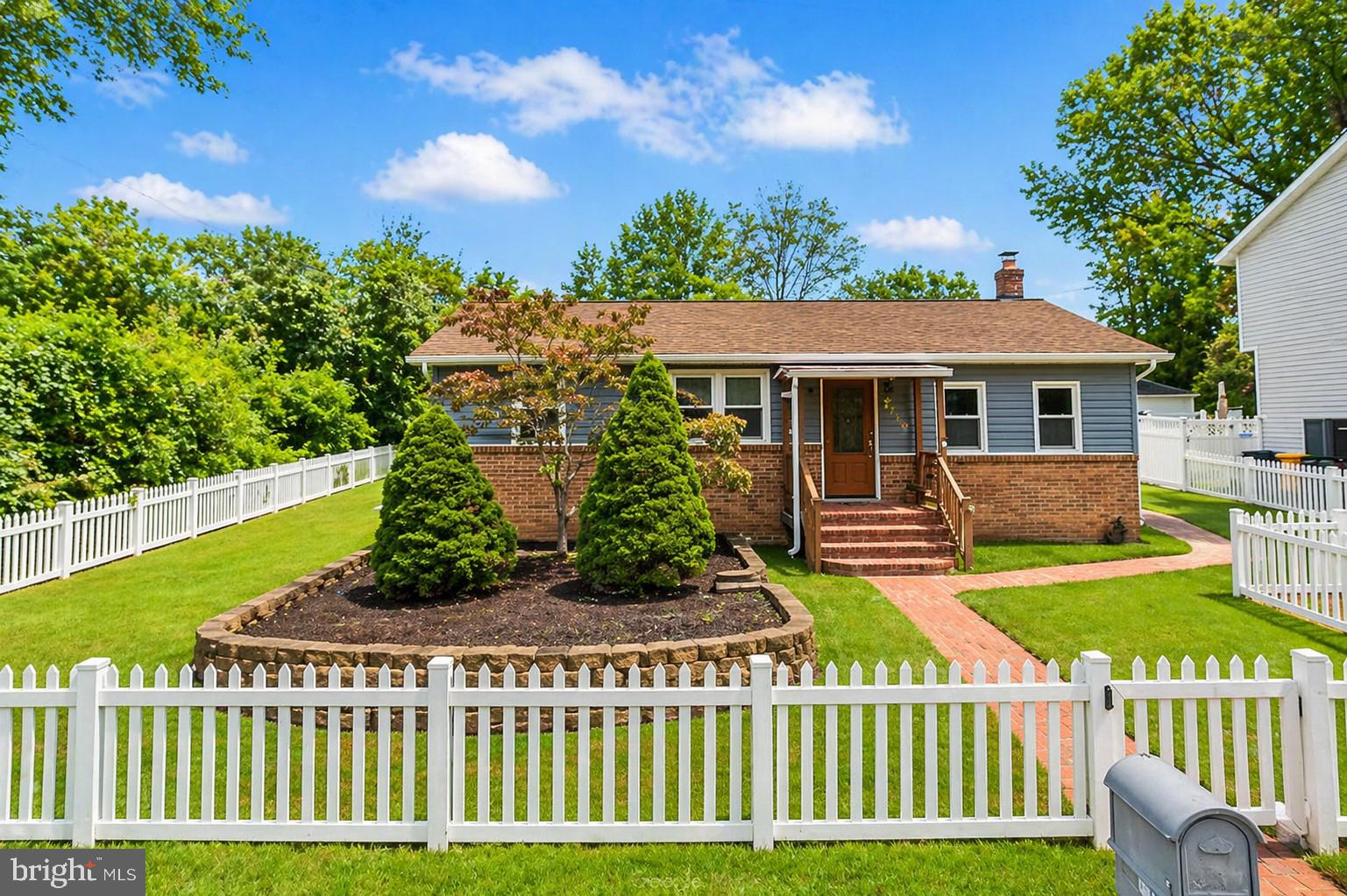 Charming home with lush greenery.