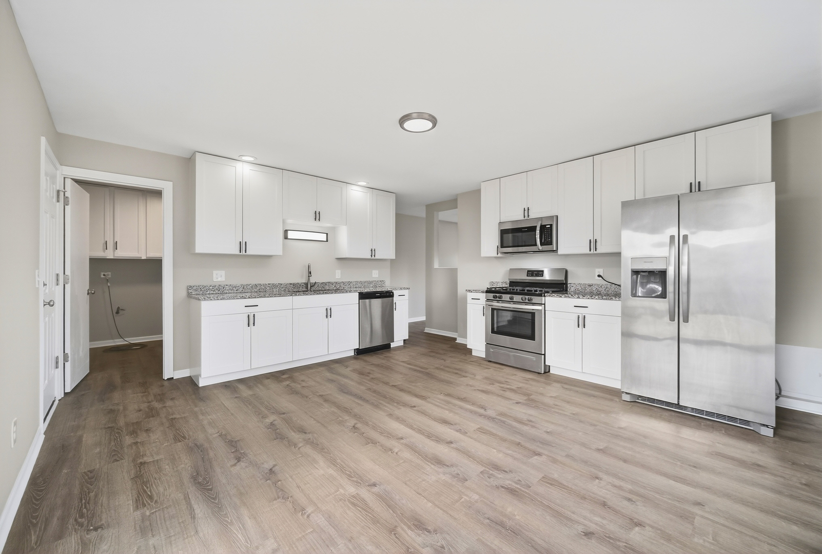 162 Heathgate Road Montgomery, IL 60538 - Photo 4 of 15 a kitchen with stainless steel appliances a refrigerator sink and microwave