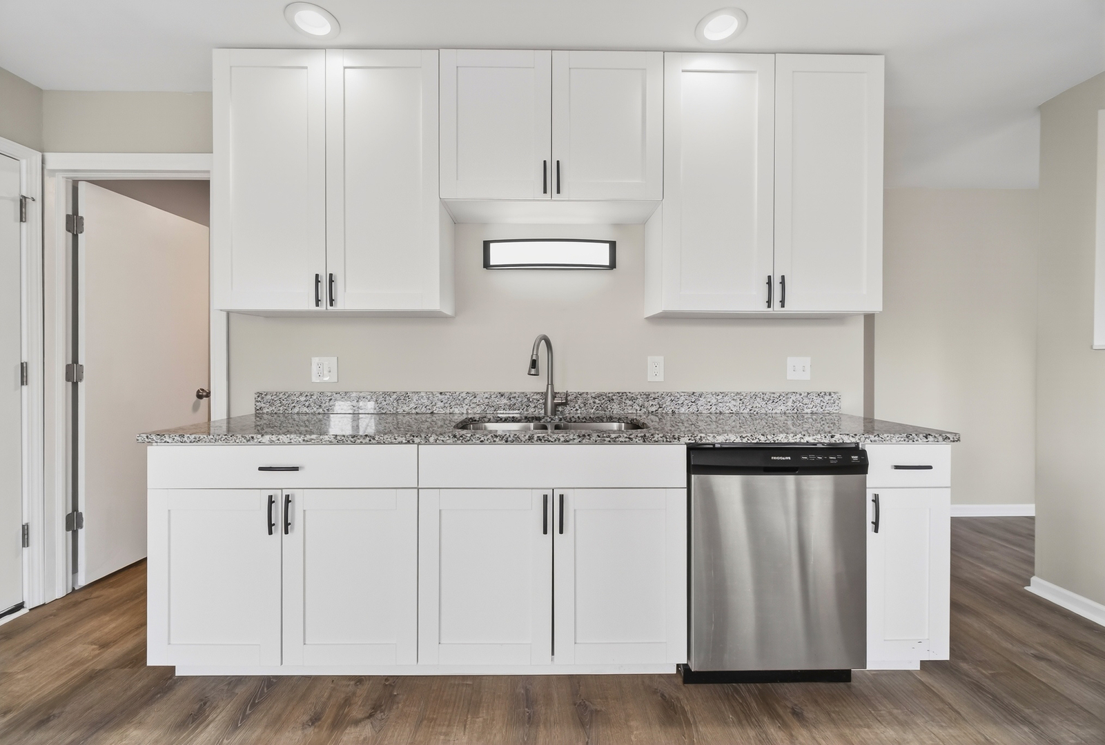 162 Heathgate Road Montgomery, IL 60538 - Photo 6 of 15 a kitchen with granite countertop white cabinets and sink