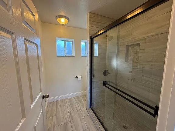 150 North Acacia Avenue Ripon, CA 95366 - Photo 18 of 54 a bathroom with a shower