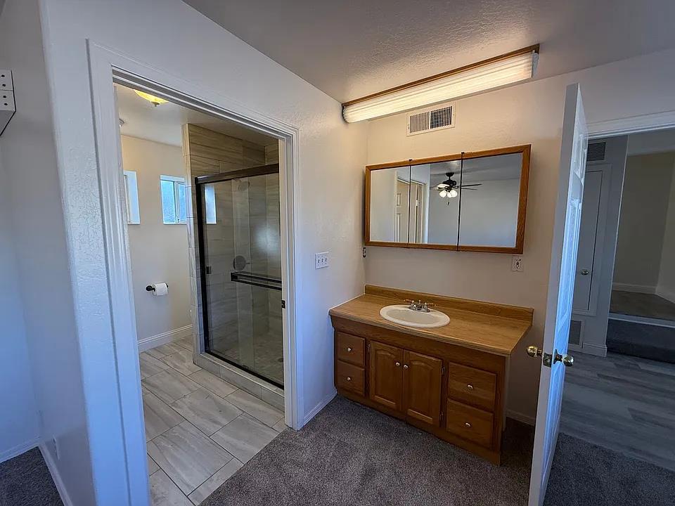 150 North Acacia Avenue Ripon, CA 95366 - Photo 20 of 54 a bathroom with a toilet sink and mirror