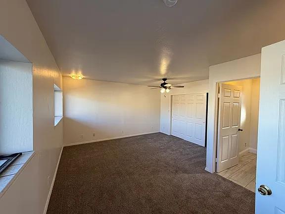 150 North Acacia Avenue Ripon, CA 95366 - Photo 22 of 54 an empty room with closet and a chandelier fan