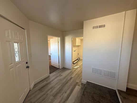 150 North Acacia Avenue Ripon, CA 95366 - Photo 24 of 54 a view of hallway with wooden floor