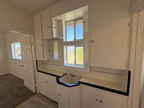 150 North Acacia Avenue Ripon, CA 95366 - Photo 27 of 54 a bathroom with a sink and a mirror