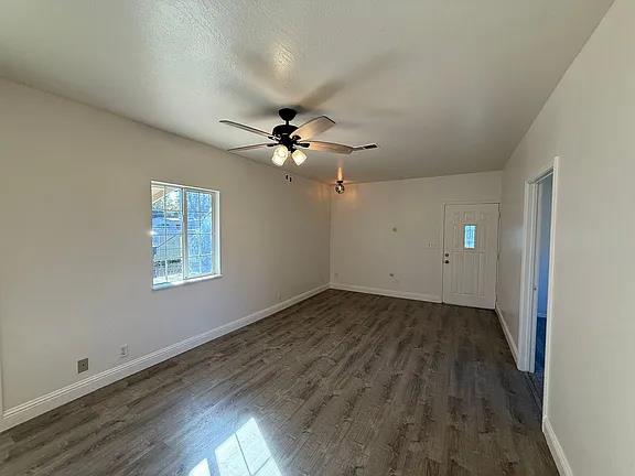 150 North Acacia Avenue Ripon, CA 95366 - Photo 32 of 54 wooden floor in an empty room with a window