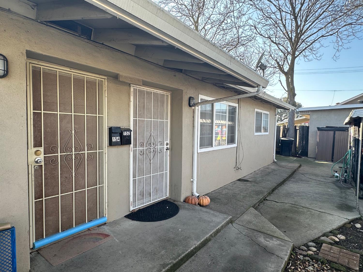 150 North Acacia Avenue Ripon, CA 95366 - Photo 35 of 54 a view of house with front door