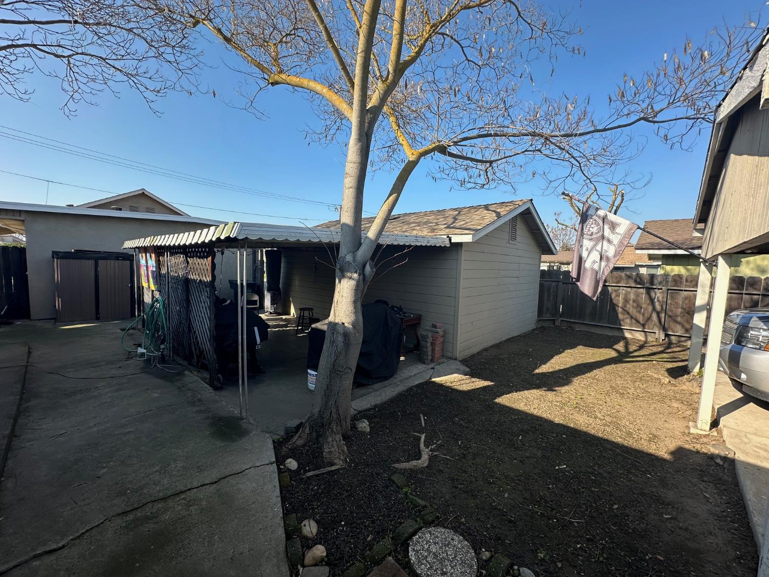 150 North Acacia Avenue Ripon, CA 95366 - Photo 40 of 54 a view of a house with backyard and sitting area