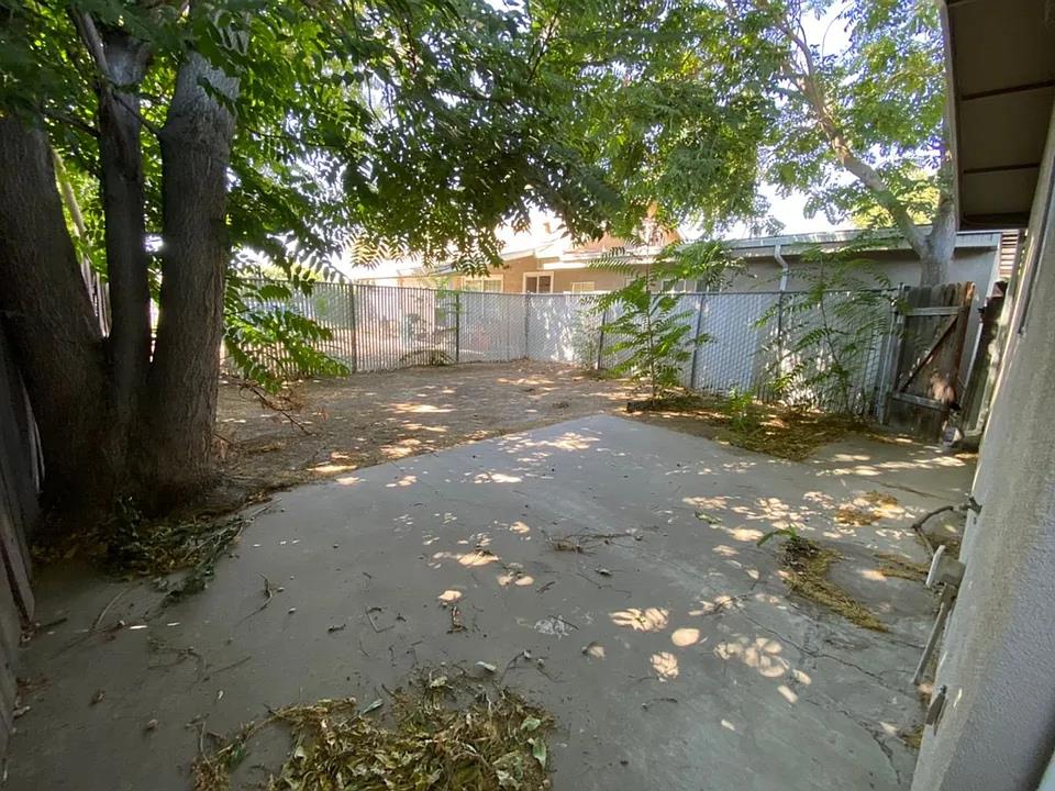150 North Acacia Avenue Ripon, CA 95366 - Photo 42 of 54 a backyard of a house with table and chairs