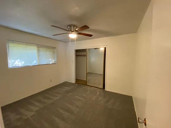 150 North Acacia Avenue Ripon, CA 95366 - Photo 46 of 54 a view of an empty room with a ceiling fan