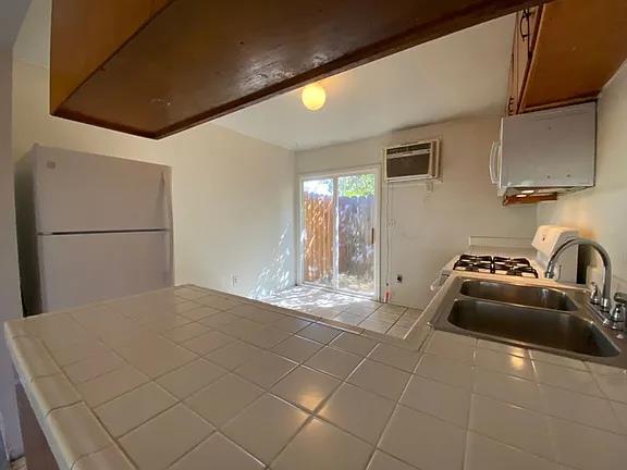 150 North Acacia Avenue Ripon, CA 95366 - Photo 51 of 54 a kitchen with stainless steel appliances granite countertop a sink and a stove