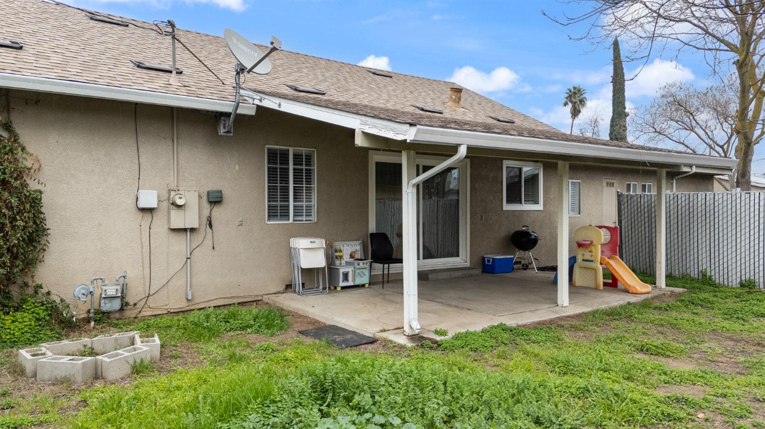 150 North Acacia Avenue Ripon, CA 95366 - Photo 7 of 54 a view of a backyard with table and chairs
