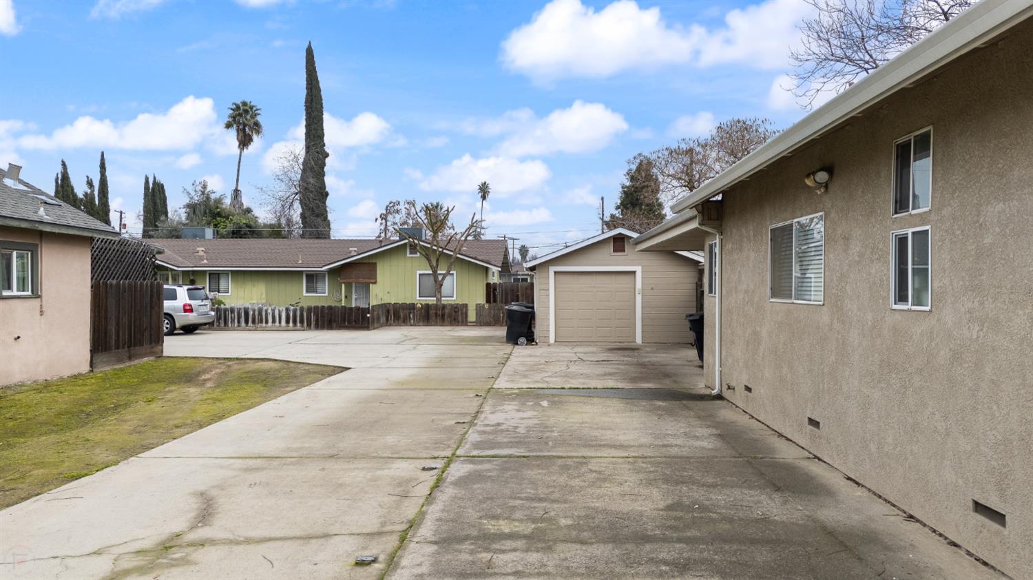 150 North Acacia Avenue Ripon, CA 95366 - Photo 9 of 54 a front view of a house with a yard