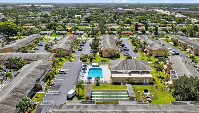 an aerial view of a house with a garden