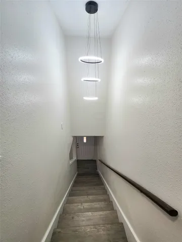a view of a hallway with a chandelier