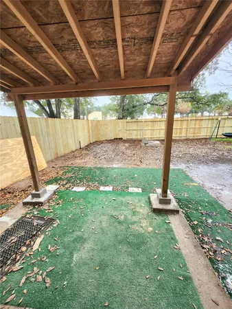 a view of a backyard with plants and garden