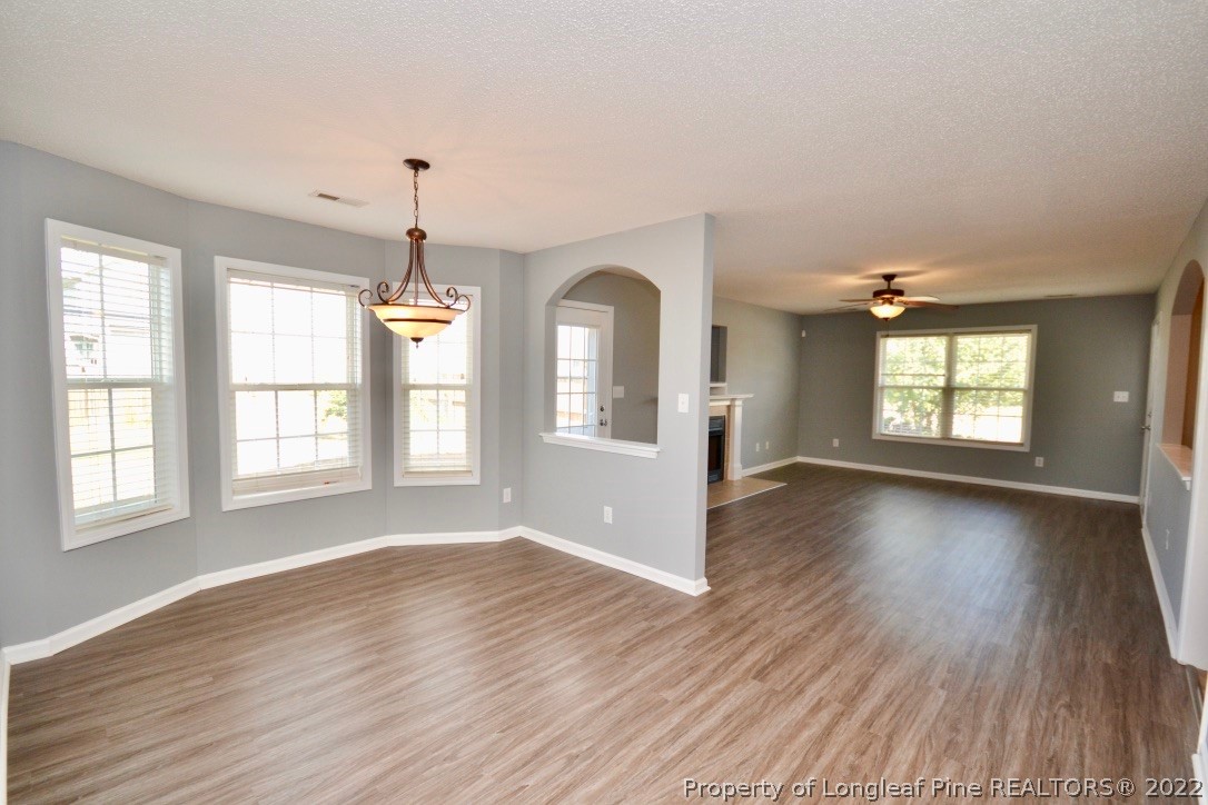 2330 Chasewater Road Fayetteville, NC 28306 - Photo 15 of 44 an empty room with wooden floor and windows