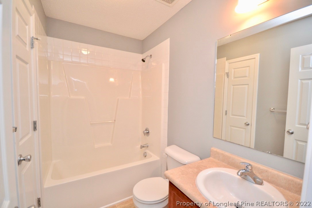 2330 Chasewater Road Fayetteville, NC 28306 - Photo 22 of 44 a bathroom with a sink toilet and shower