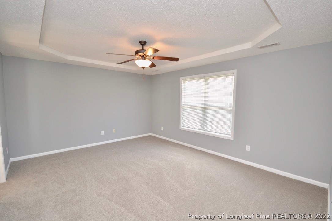 2330 Chasewater Road Fayetteville, NC 28306 - Photo 23 of 44 an empty room with a window and a ceiling fan