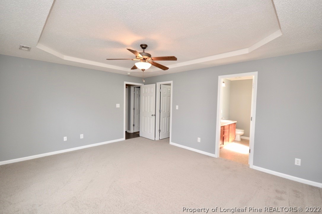 2330 Chasewater Road Fayetteville, NC 28306 - Photo 26 of 44 a view of a big room with closet and chandelier fan