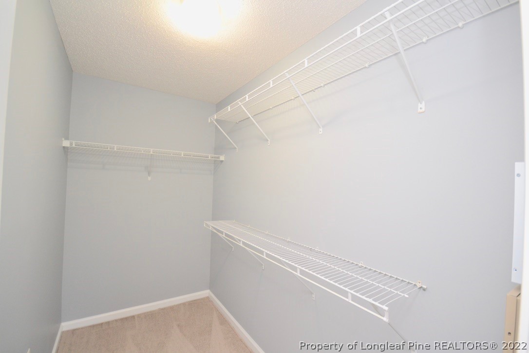 2330 Chasewater Road Fayetteville, NC 28306 - Photo 27 of 44 a view of a room with racks on the wall