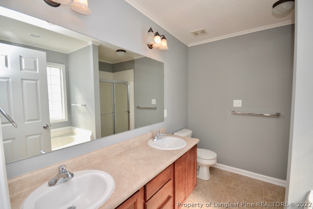 2330 Chasewater Road Fayetteville, NC 28306 - Photo 28 of 44 a bathroom with a sink and a mirror