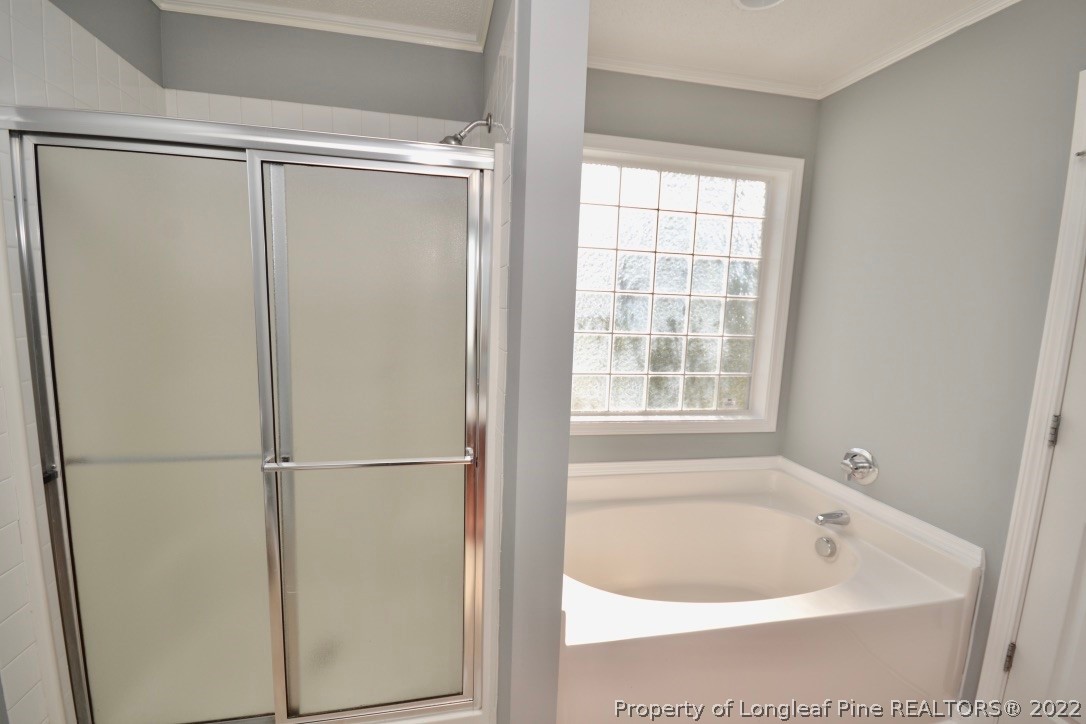 2330 Chasewater Road Fayetteville, NC 28306 - Photo 31 of 44 a bathroom with a bathtub and a shower