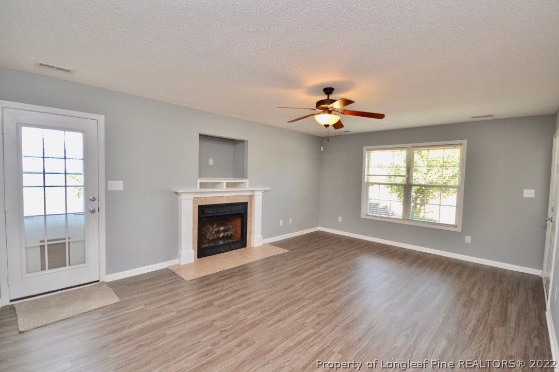 2330 Chasewater Road Fayetteville, NC 28306 - Photo 4 of 44 a view of an empty room with a window and fireplace