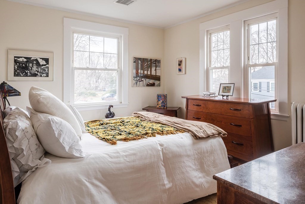 26 Islington Road Newton, MA 02466 - Photo 12 of 18 a bedroom with a bed and wooden floor
